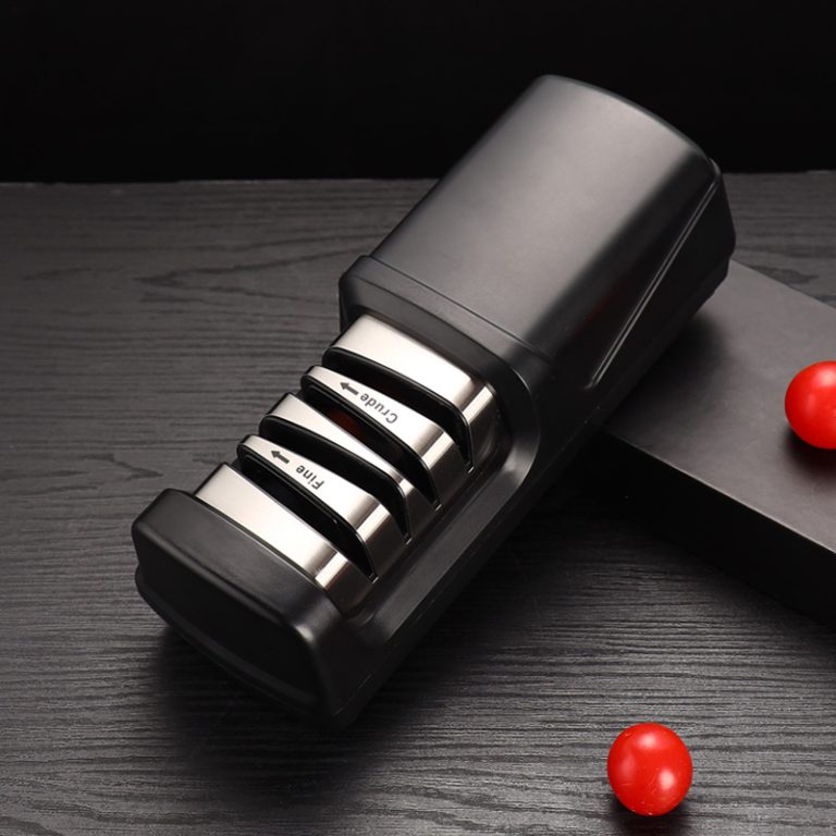 Black S865 knife sharpener with “Crude” and “Fine” slots, placed on a dark wooden surface
