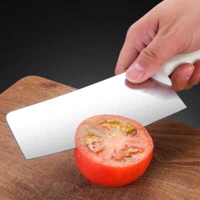 using the knife cut a piece of tomato